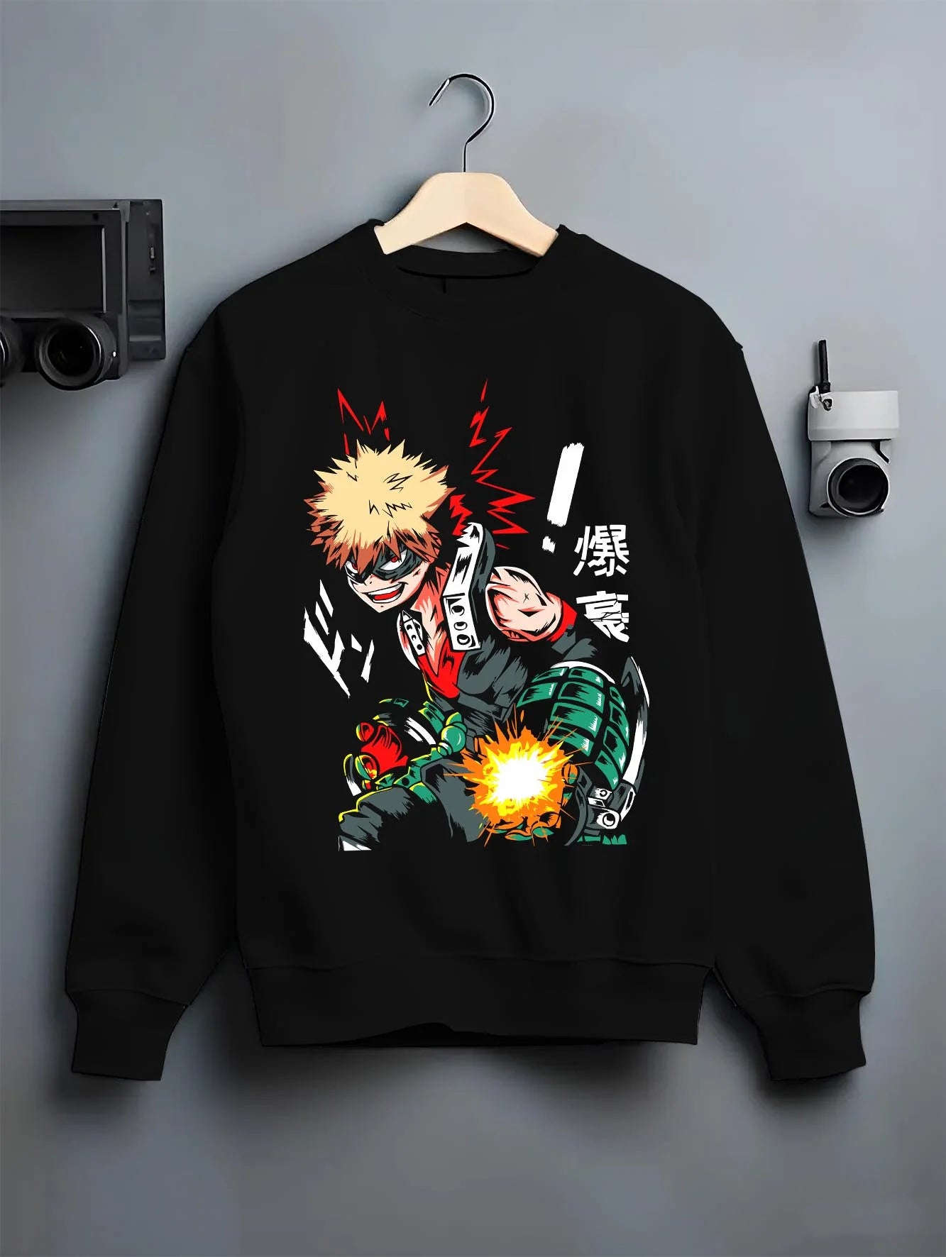 Black crewneck sweatshirt on hanger with Bakugo Hero Hoodie My Hero Academia Green Blast Scene graphic streetwear graphic.