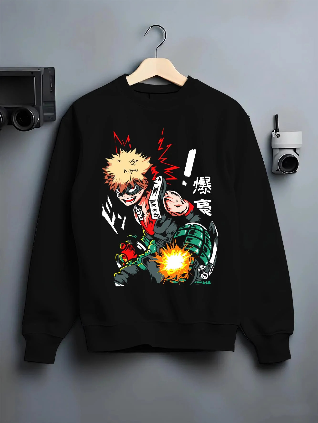 Black crewneck sweatshirt on hanger with Bakugo Hero Hoodie My Hero Academia Green Blast Scene graphic streetwear graphic.