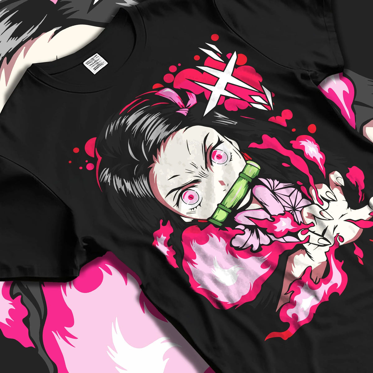 Black T-shirt laid flat with natural folds featuring Nezuko Kamado Demon Slayer blood art artwork.