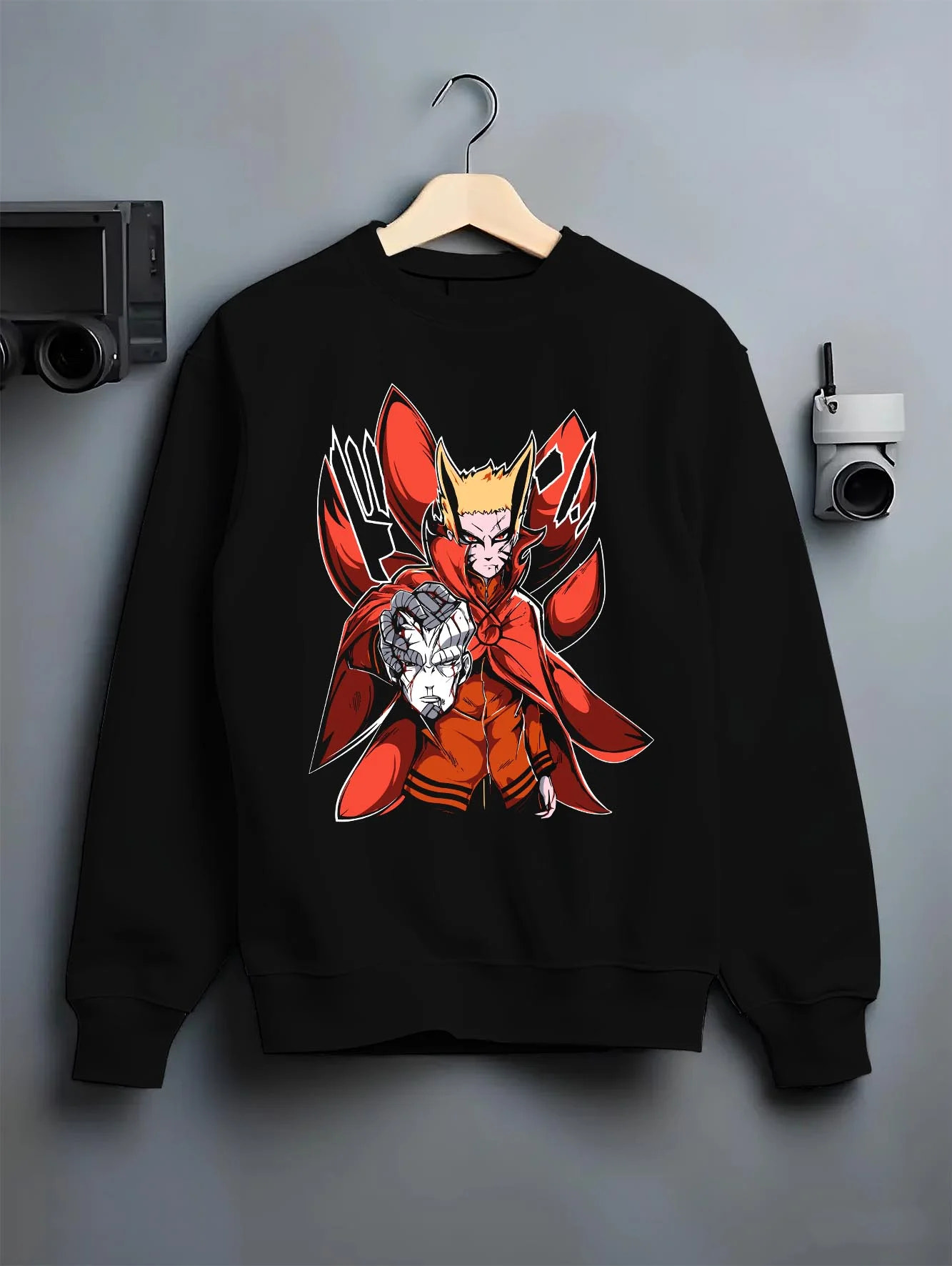 Black crewneck sweatshirt on hanger with Naruto Uzumaki Hoodie Baryon Mode Battle Jumper graphic premium wear.