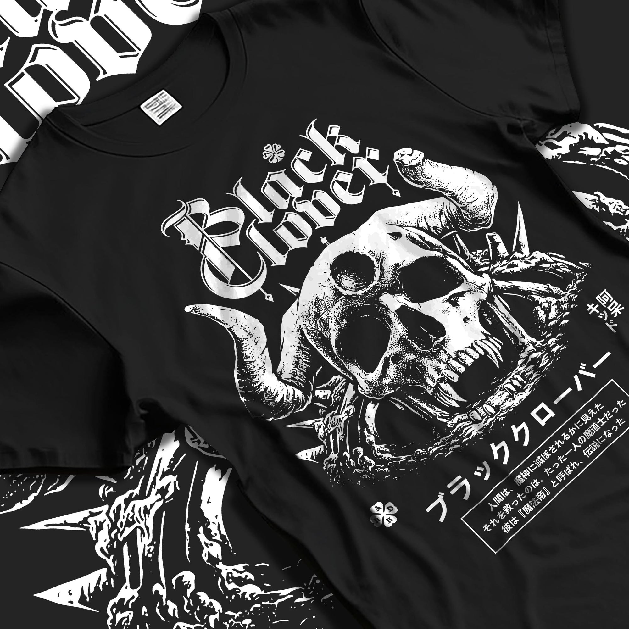 Black T-shirt laid flat with natural fabric folds, featuring Black Clover anime poster inspired skull design with dark manga streetwear style artwork.