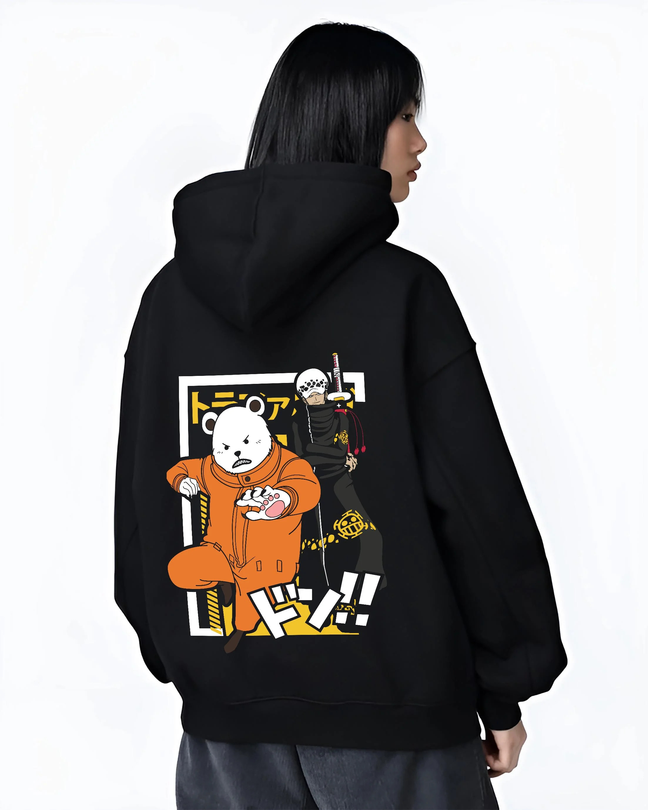 Black hoodie worn by female model, back view with Polar Bear Hoodie Shirokuma Cafe Anime Retro Poster graphic bold anime graphic.