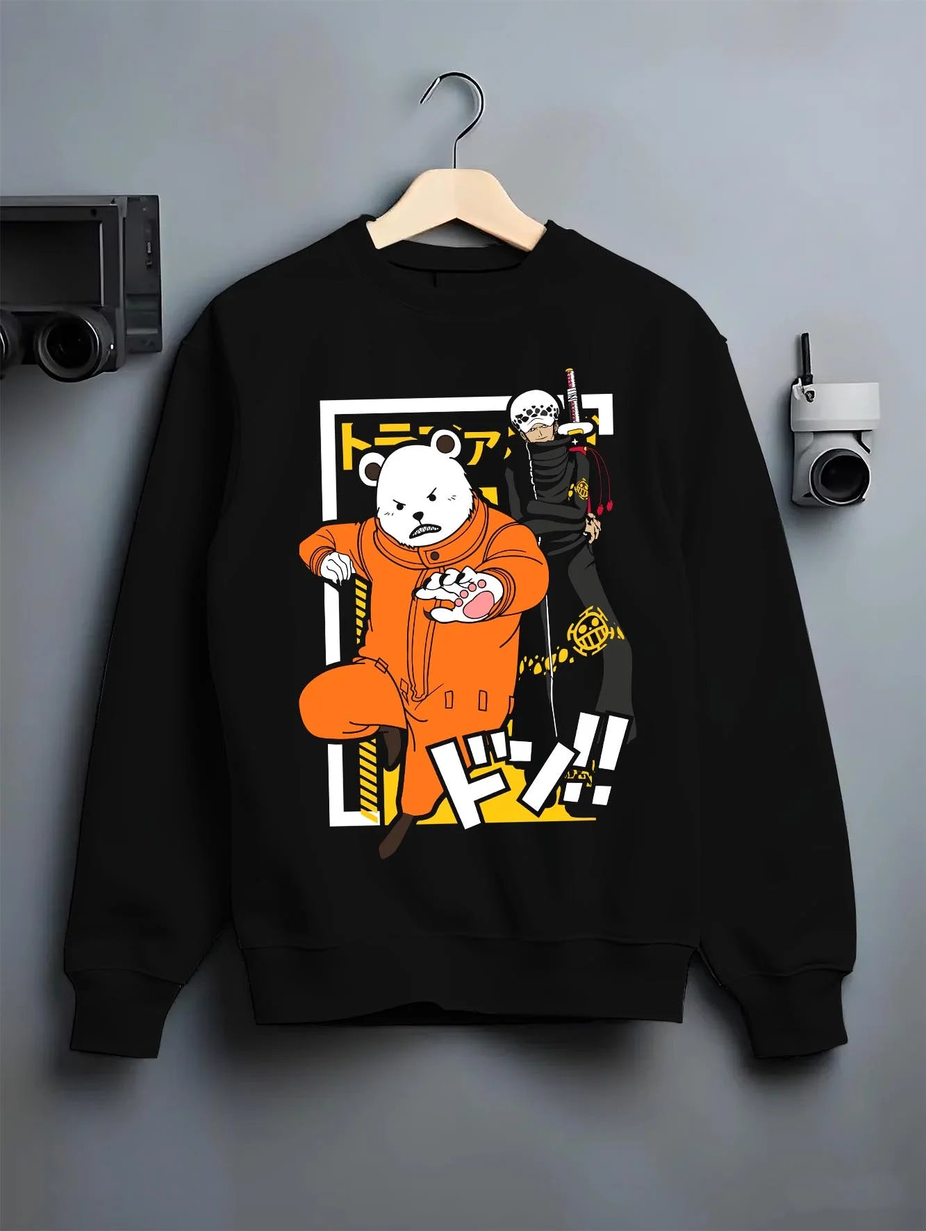 Black crewneck sweatshirt on hanger with Polar Bear Hoodie Shirokuma Cafe Anime Retro Poster graphic bold anime graphic.