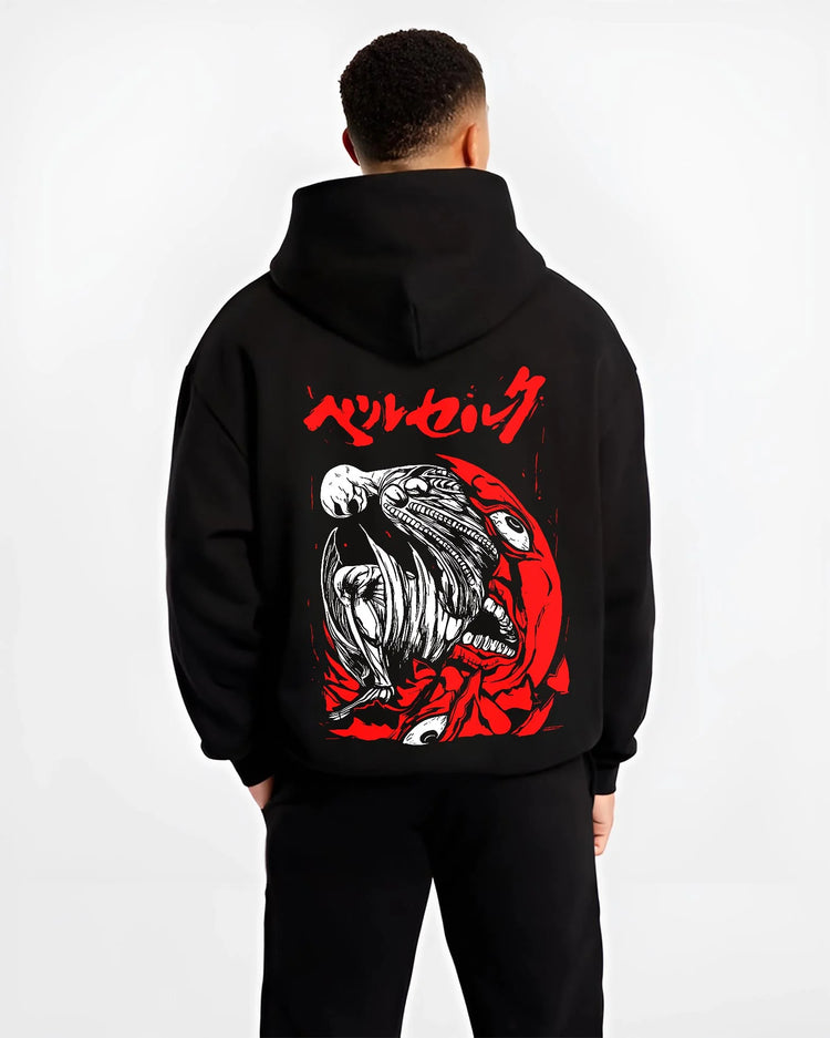 Black hoodie worn by male model, back view with Berserk Skull Hoodie Behelit Eclipse Bloody Crimson graphic streetwear graphic.