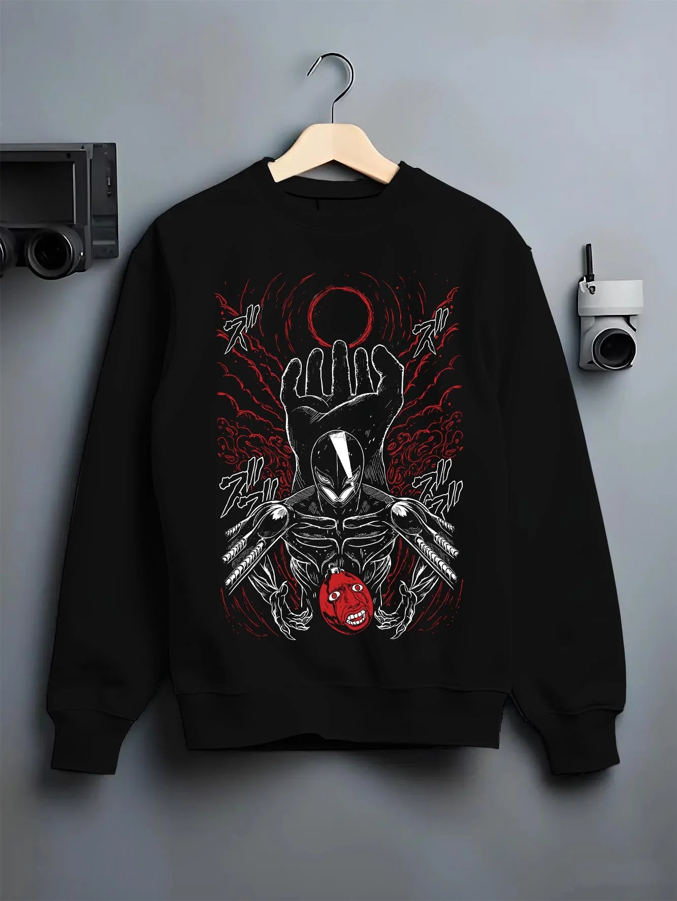 Black crewneck sweatshirt on hanger with Berserk Eclipse Hoodie Crimson Hand of God Eclipse graphic streetwear graphic.