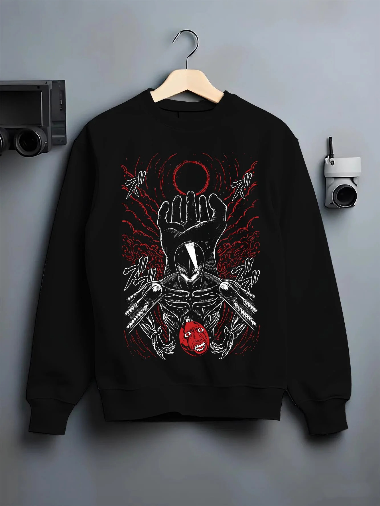 Black crewneck sweatshirt on hanger with Berserk Eclipse Hoodie Crimson Hand of God Eclipse graphic streetwear graphic.