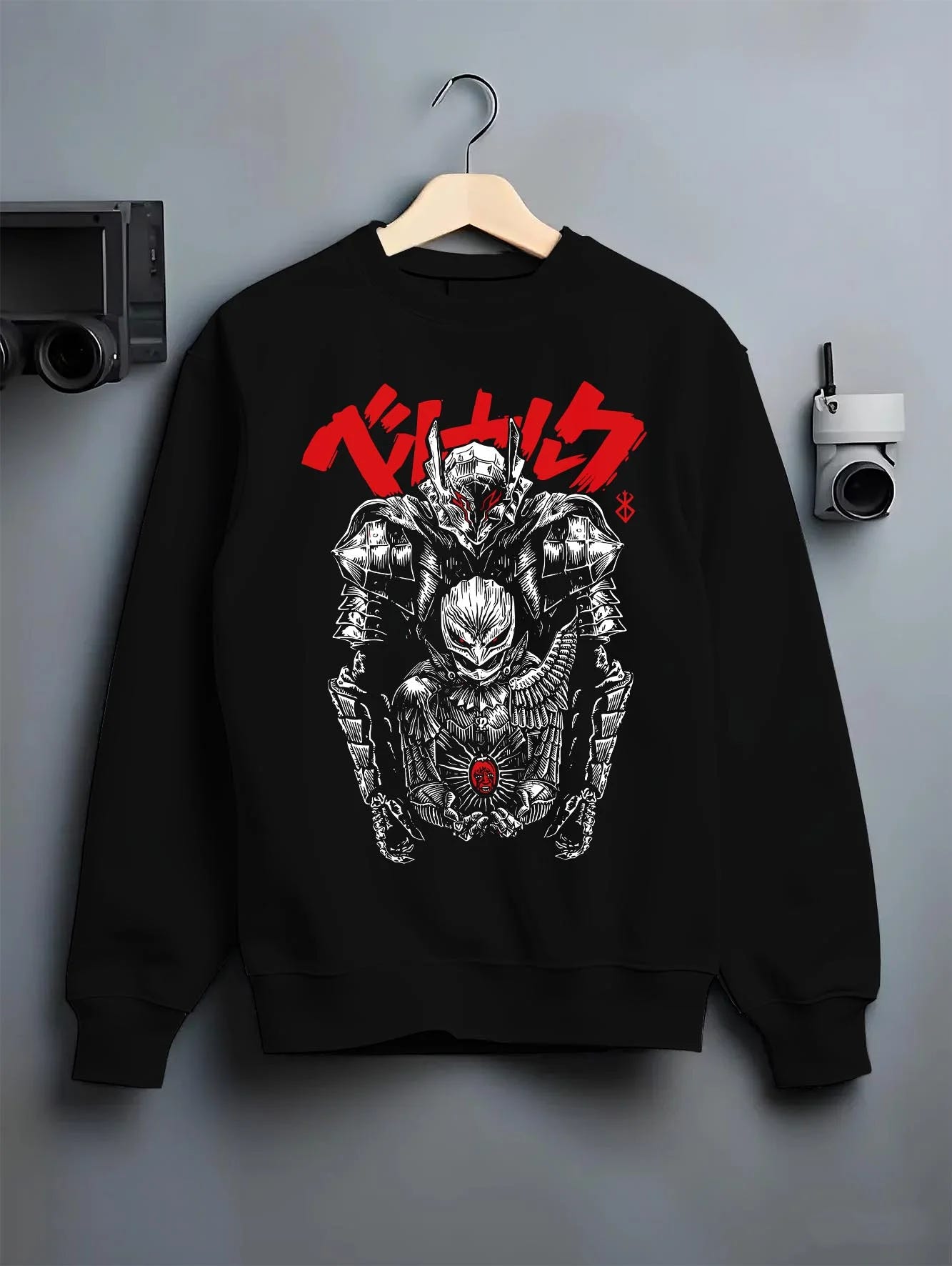Black crewneck sweatshirt on hanger with Berserk Skull Knight Hoodie Dark Eclipse Warrior graphic bold anime graphic.