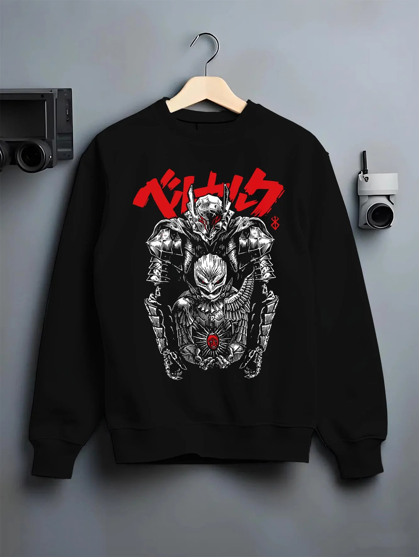Black crewneck sweatshirt on hanger with Berserk Skull Knight Hoodie Dark Eclipse Warrior graphic bold anime graphic.