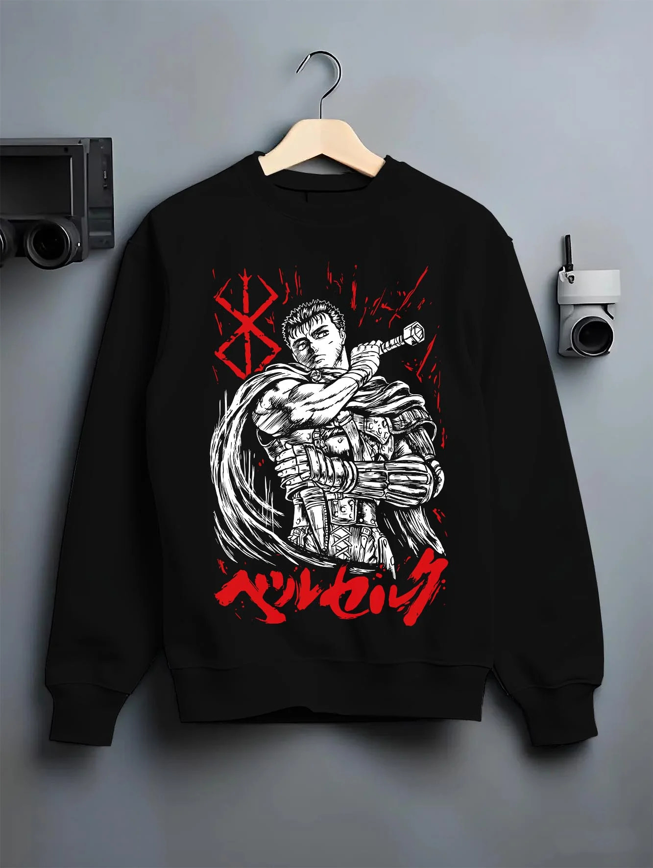 Black crewneck sweatshirt on hanger with Berserk Guts Hoodie Black Swordsman Dark Blade Stare graphic Guts themed artwork.