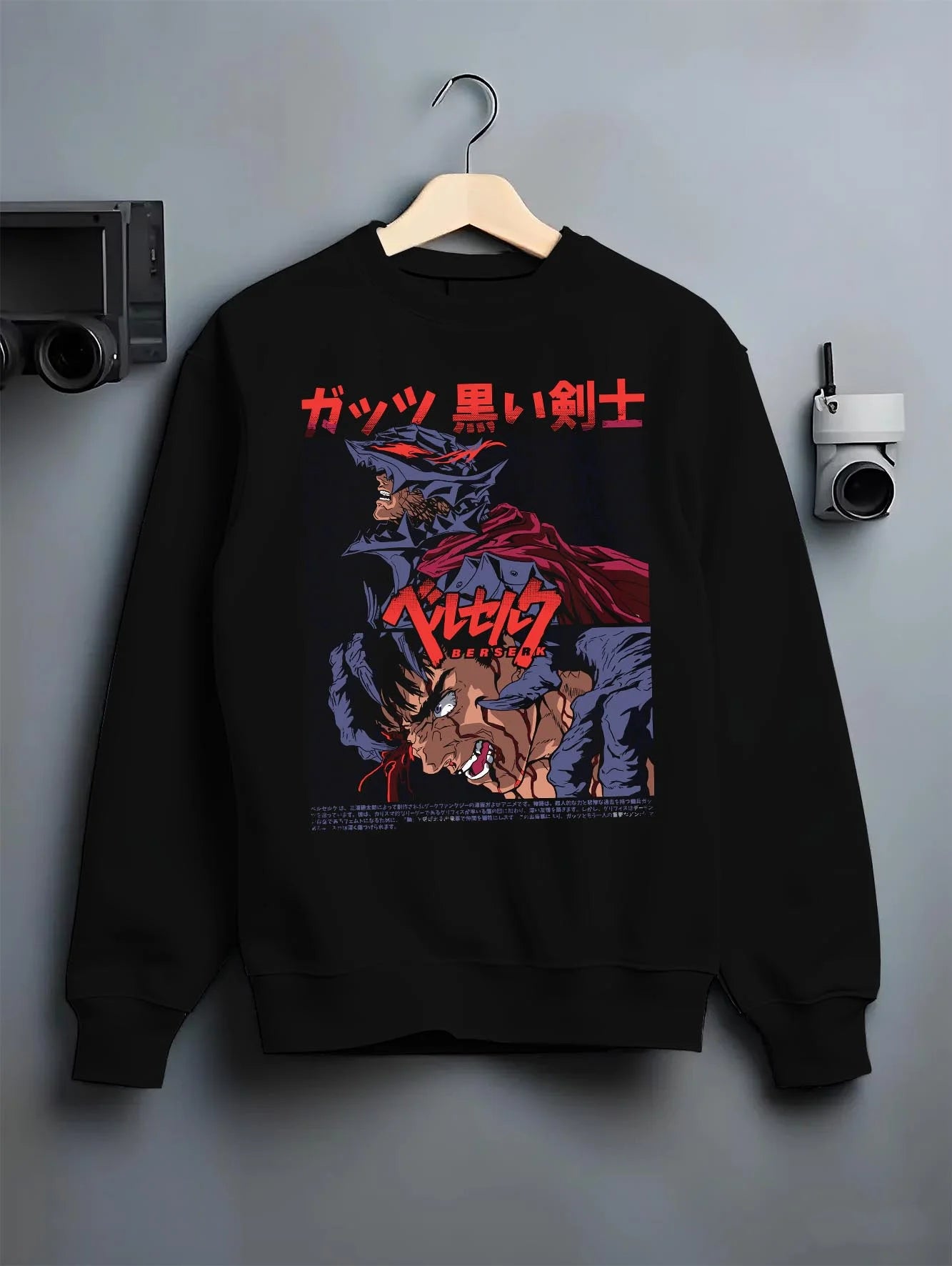 Black crewneck sweatshirt on hanger with Berserk Guts Hoodie Dark Swordsman Bloody Poster graphic streetwear graphic.