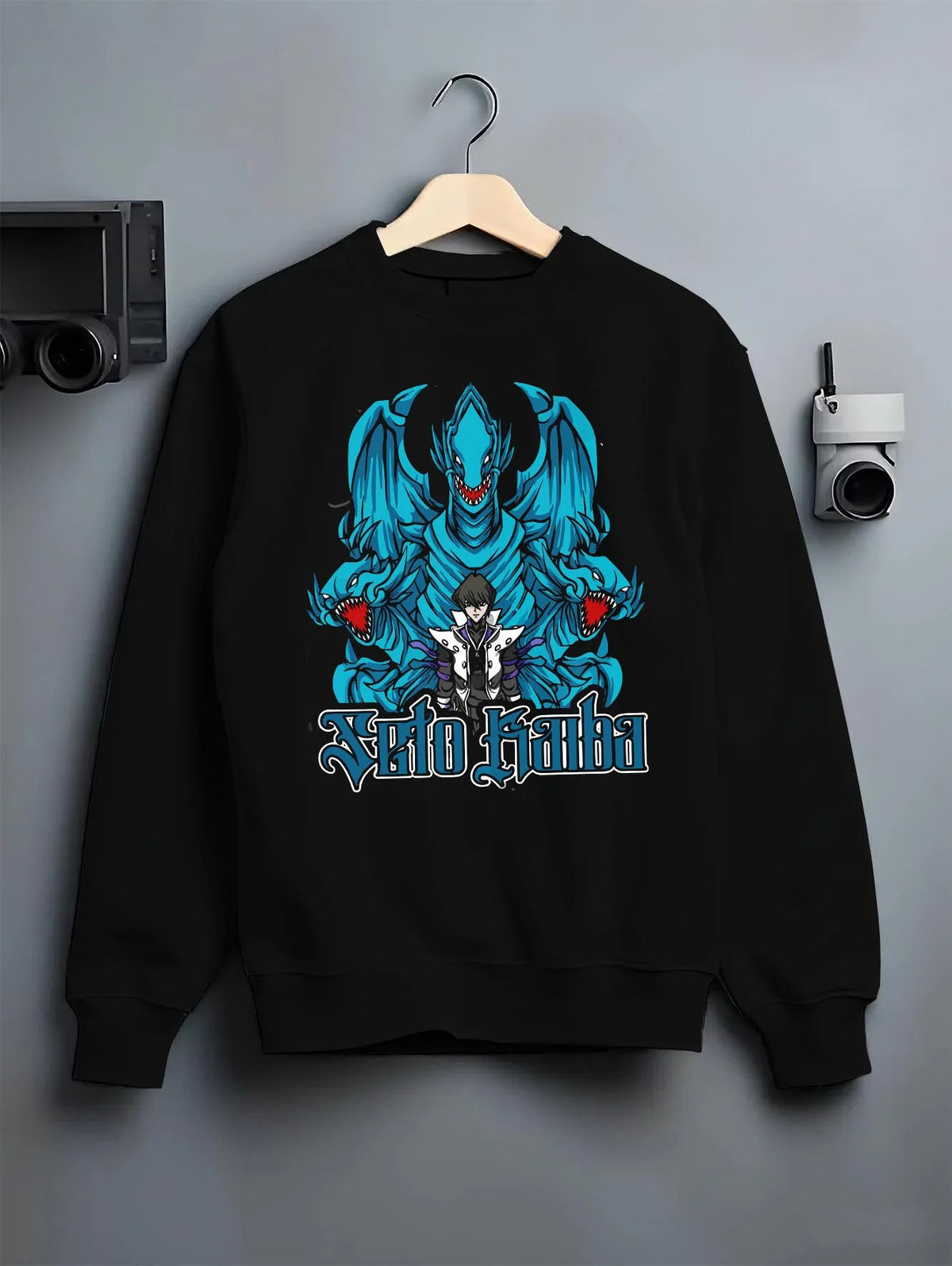 Black crewneck sweatshirt on hanger featuring Blue-Eyes White Dragon Yu-Gi-Oh artwork.