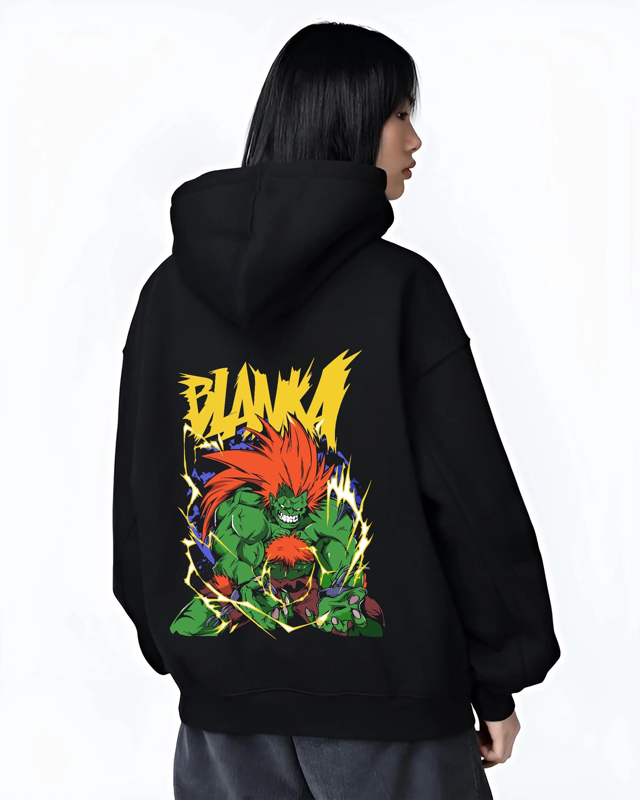 Black hoodie worn by female model, back view with Blanka Hoodie Street Fighter Green Beast Retro Roar graphic streetwear graphic.