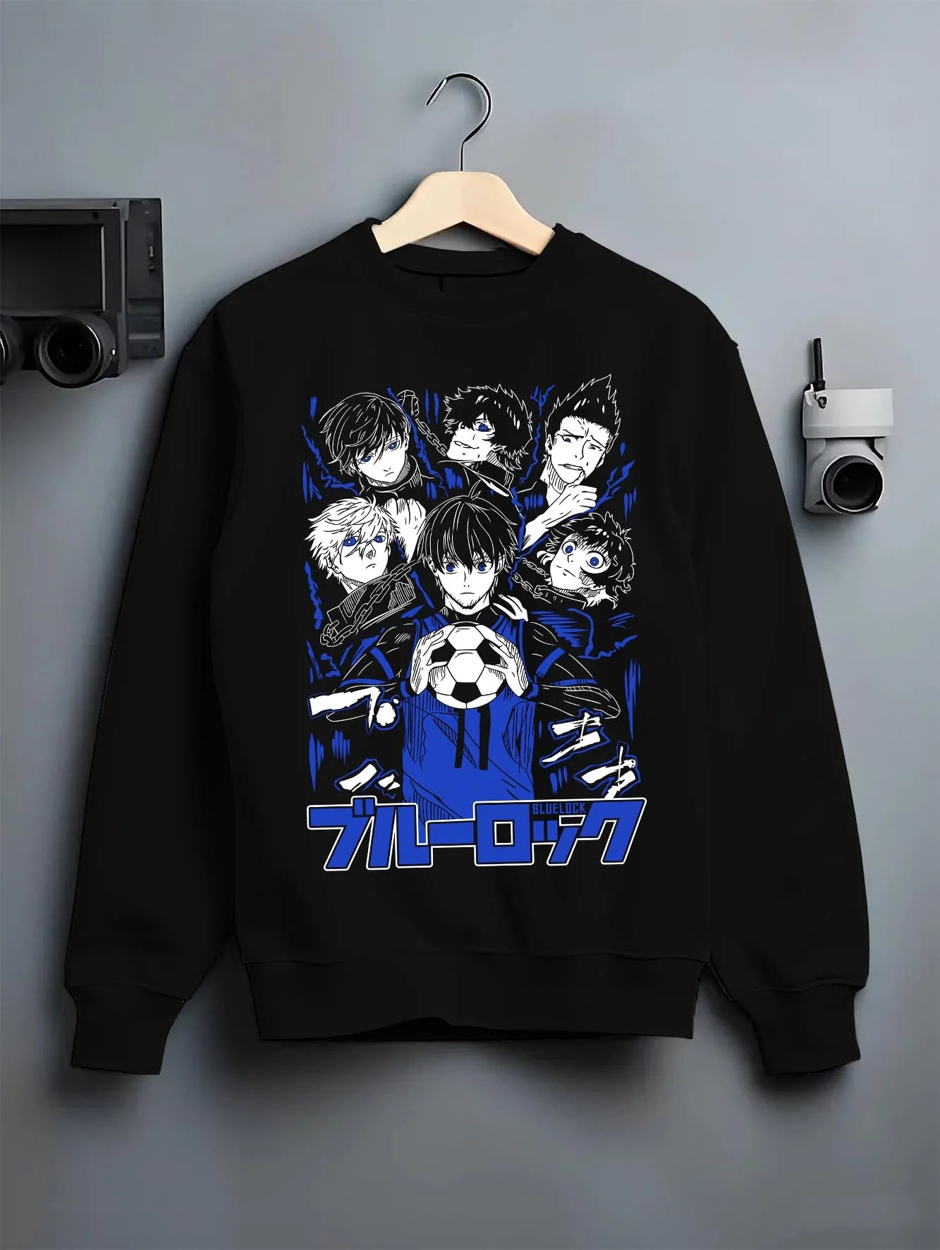 Black crewneck sweatshirt on hanger with Blue Lock Hoodie Japan Soccer Team Chain Collection graphic bold anime graphic.