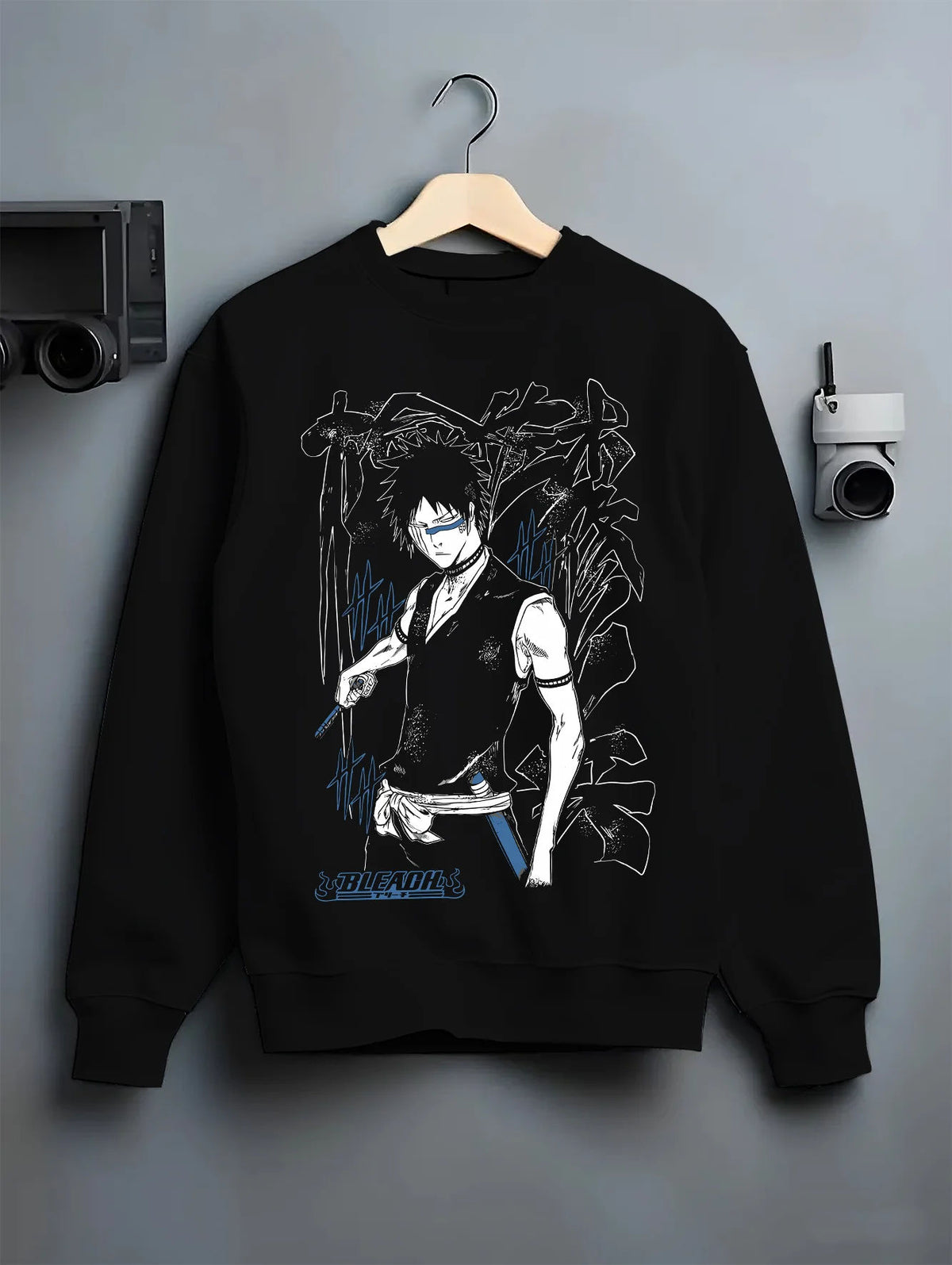 Black crewneck sweatshirt on hanger showing Bleach: dark-haired swordsman with sword