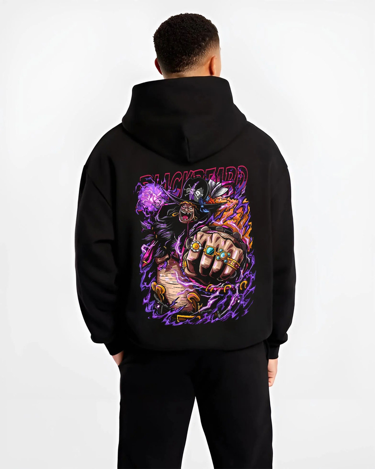 Black hoodie worn by male model from the back featuring Blackbeard One Piece dark power artwork.