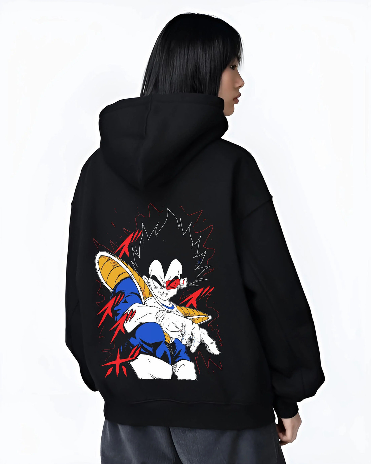 Black hoodie worn by female model from the back featuring Vegeta Dragon Ball Saiyan armour artwork.