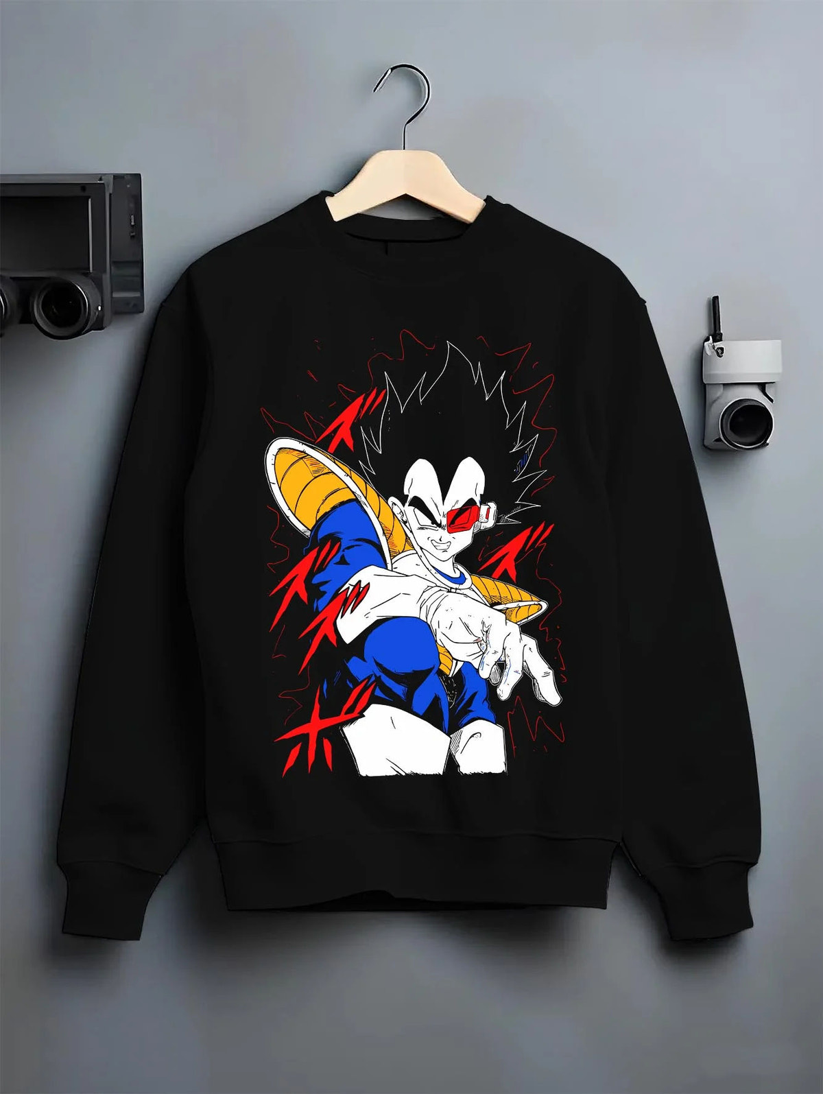 Black crewneck sweatshirt on hanger featuring Vegeta Dragon Ball Saiyan armour artwork.