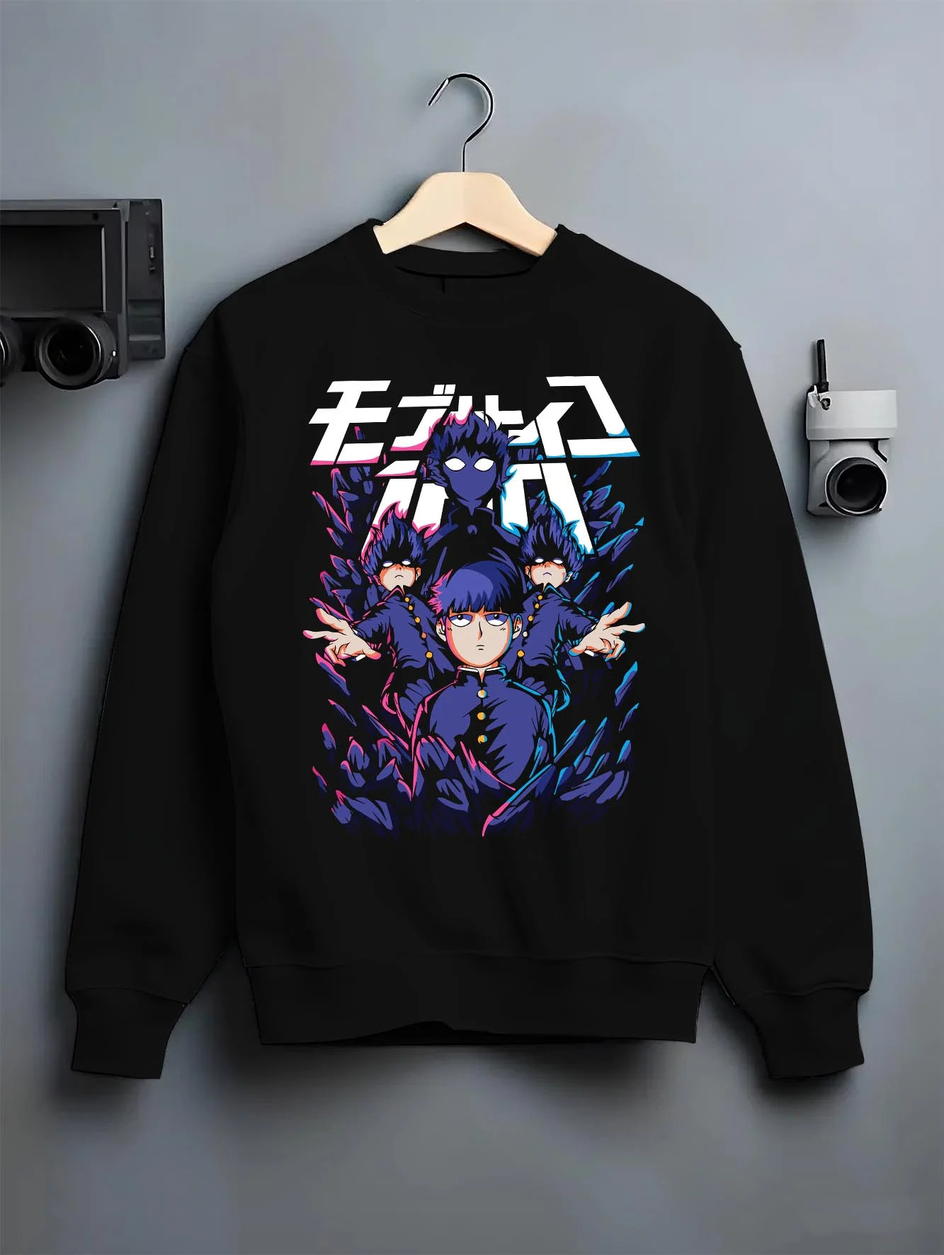Black crewneck sweatshirt on hanger with Mob Psycho 100 Hoodie Blue Spirit Energy Jumper graphic bold anime graphic.