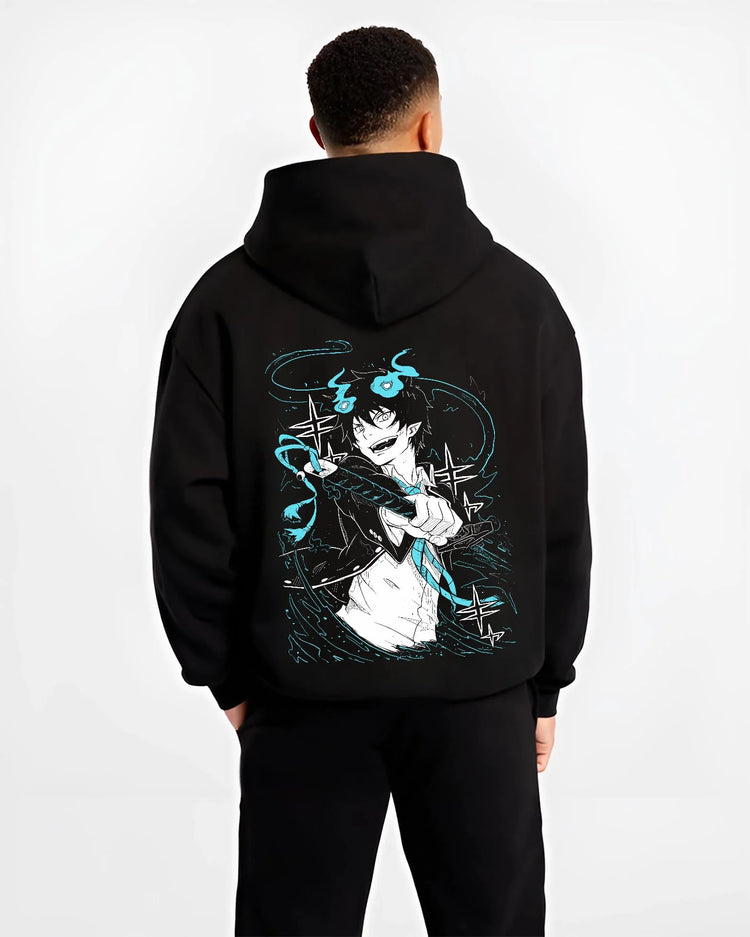 Black hoodie worn by male model, back view featuring Rin Okumura Blue Exorcist shonen battle character artwork with bold Japanese animation streetwear design.