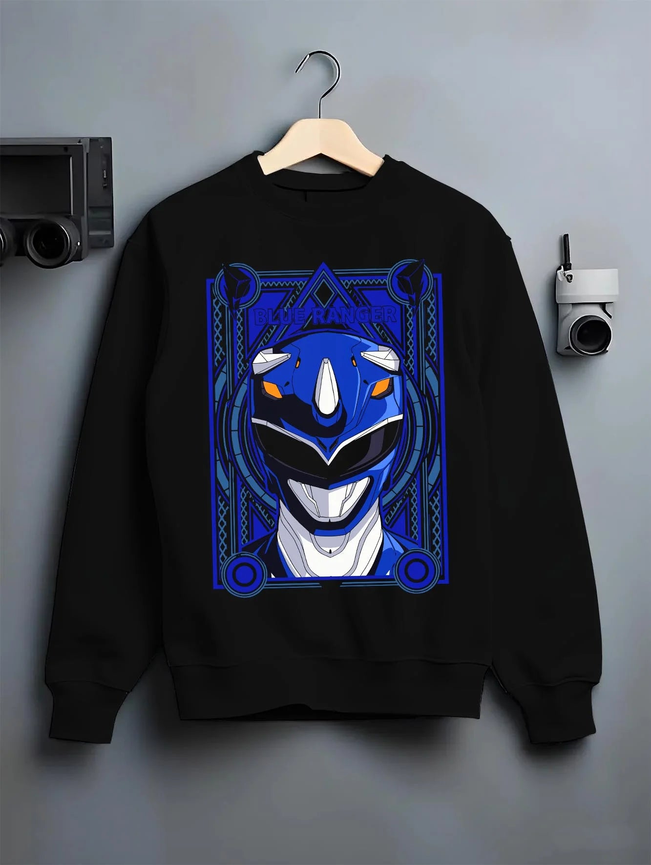 Black crewneck sweatshirt on hanger with Blue Ranger Hoodie Power Rangers Classic Retro Pose graphic streetwear graphic.