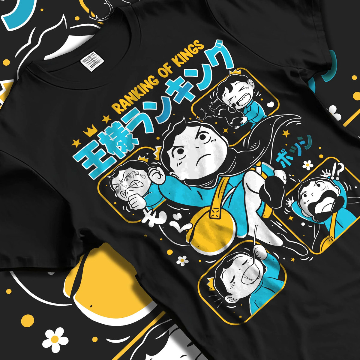 Black T-shirt laid flat with natural folds featuring Bojji Kage Ranking of Kings character artwork.