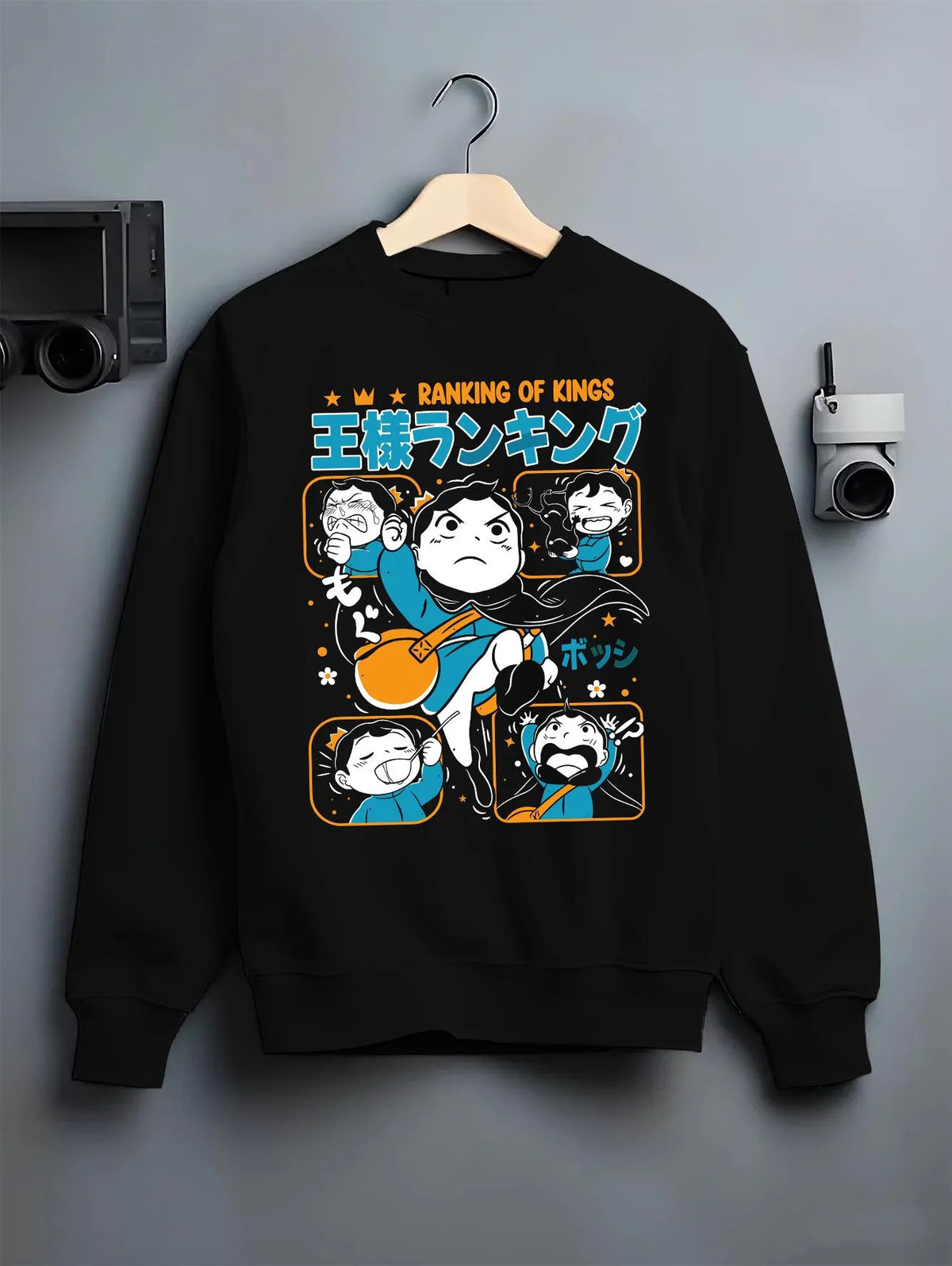 Black crewneck sweatshirt on hanger featuring Bojji Kage Ranking of Kings character artwork.