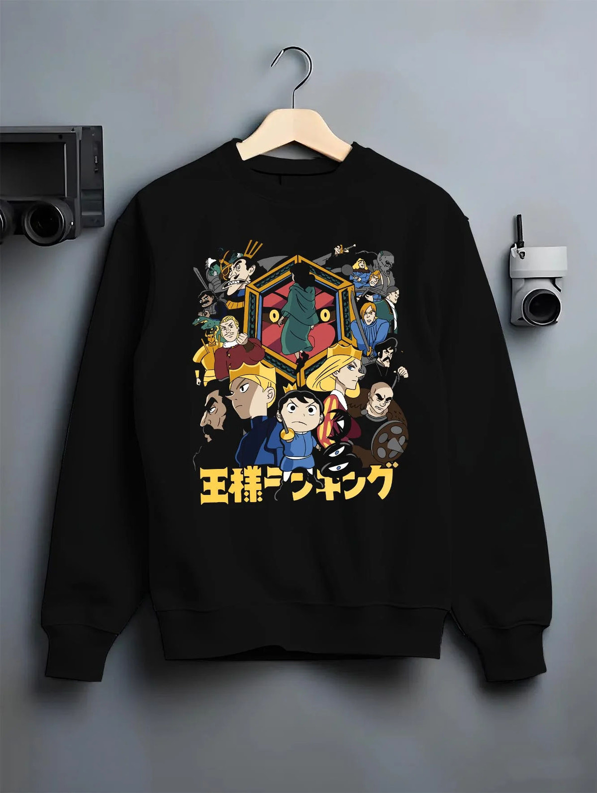 Black crewneck sweatshirt on hanger featuring Bojji Prince Ranking of Kings artwork.