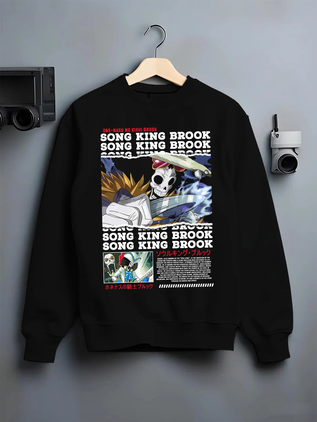 Black crewneck sweatshirt on hanger with Brook Hoodie One Piece Soul King Retro Music Poster graphic streetwear graphic.