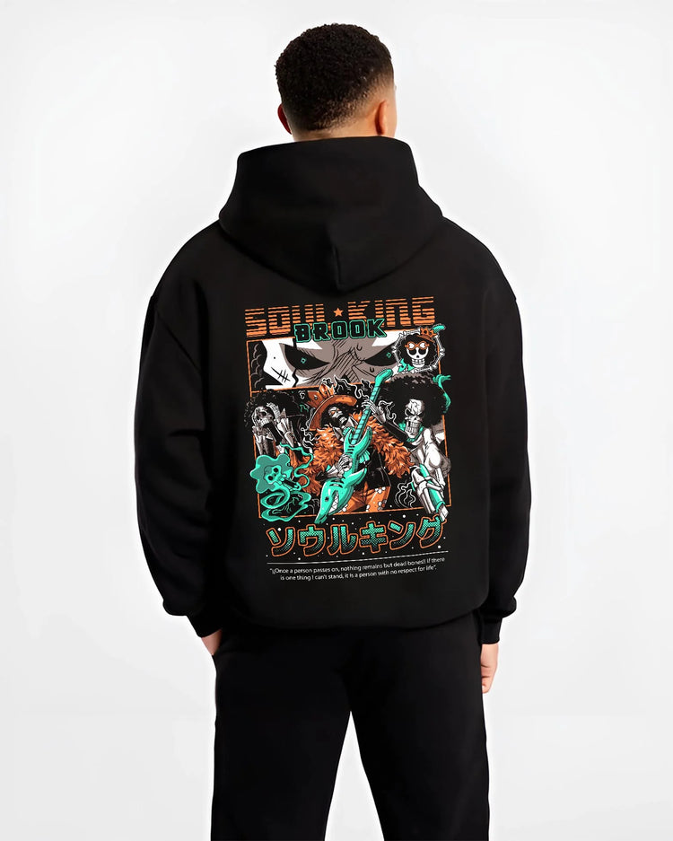 Black hoodie worn by male model, back view with Brook Soul King Hoodie One Piece Flame Music Scene graphic premium wear.