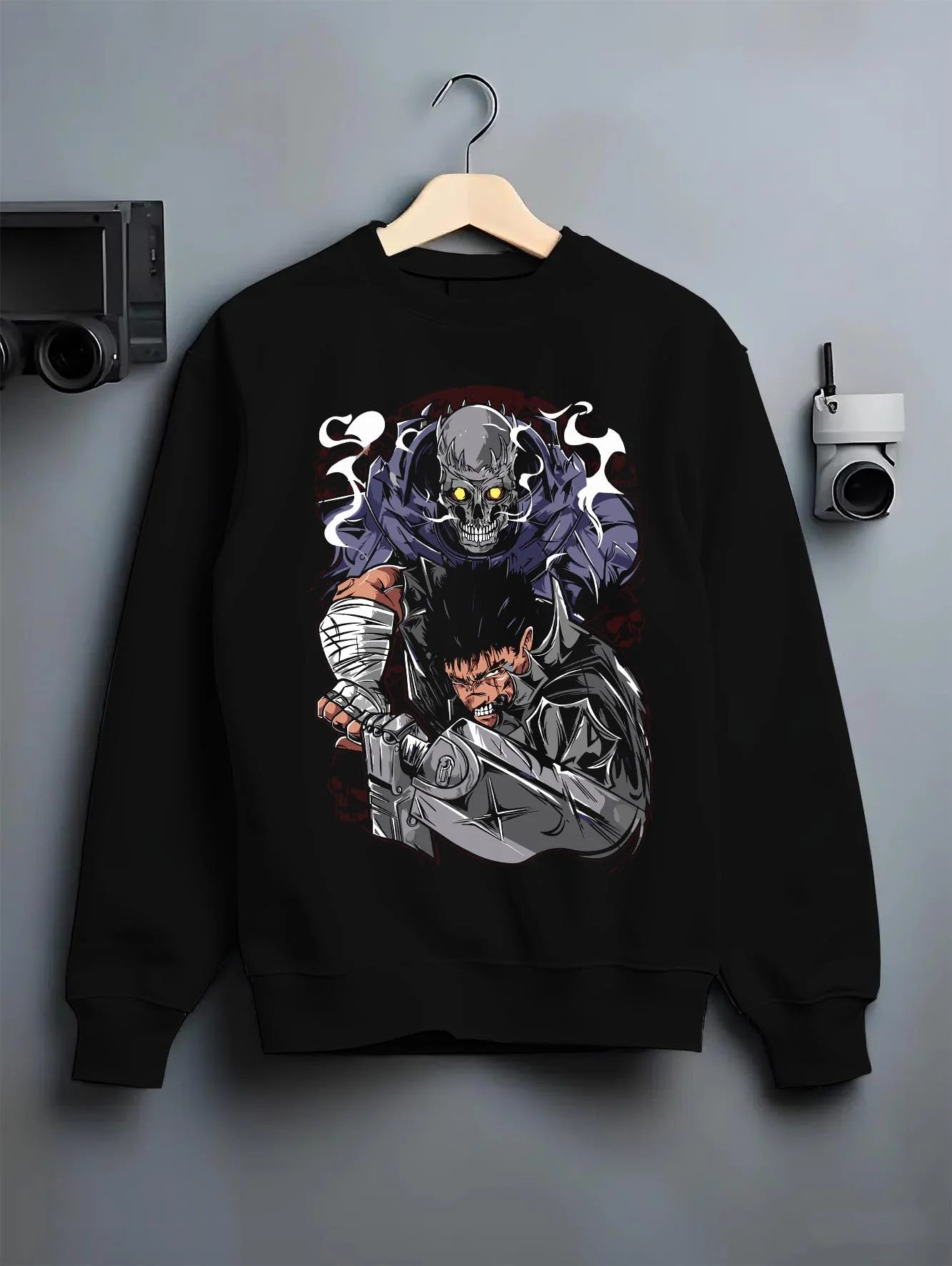 Black crewneck sweatshirt on hanger with Guts Berserk Hoodie Eclipse Hero Dark Blade Poster graphic Guts themed artwork.