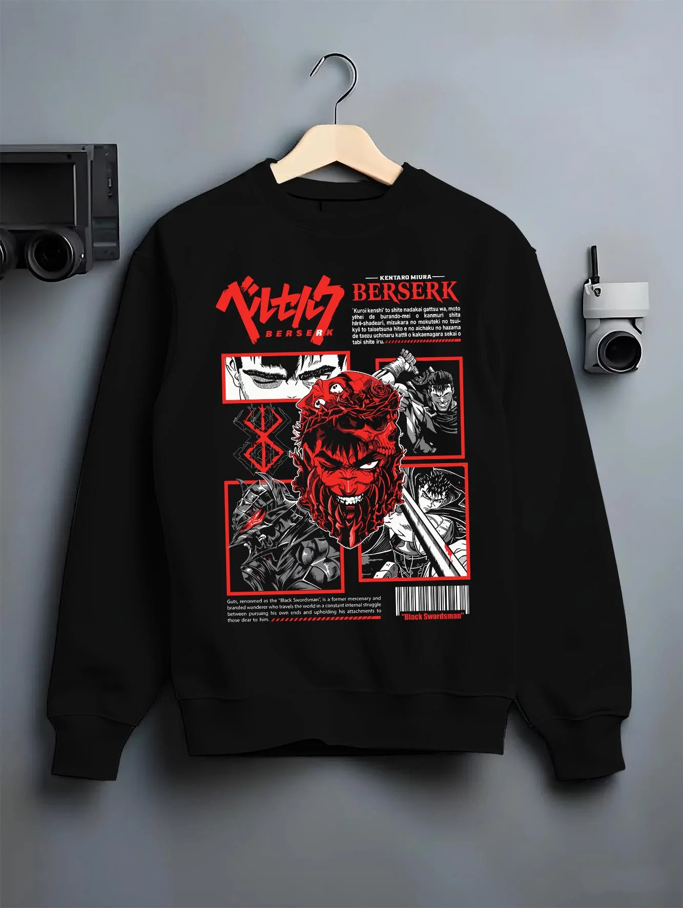 Black crewneck sweatshirt on hanger with Berserk Eclipse Hoodie Bloody Behelit Red Demon Face graphic streetwear graphic.
