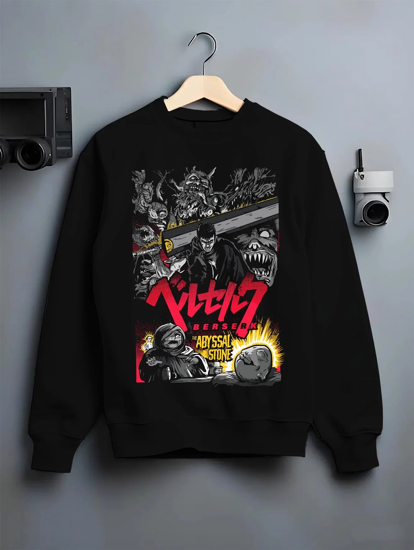 Black crewneck sweatshirt on hanger with Berserk Abyss Hoodie Guts Wielding Dragon Slayer Sword graphic Guts anime design.