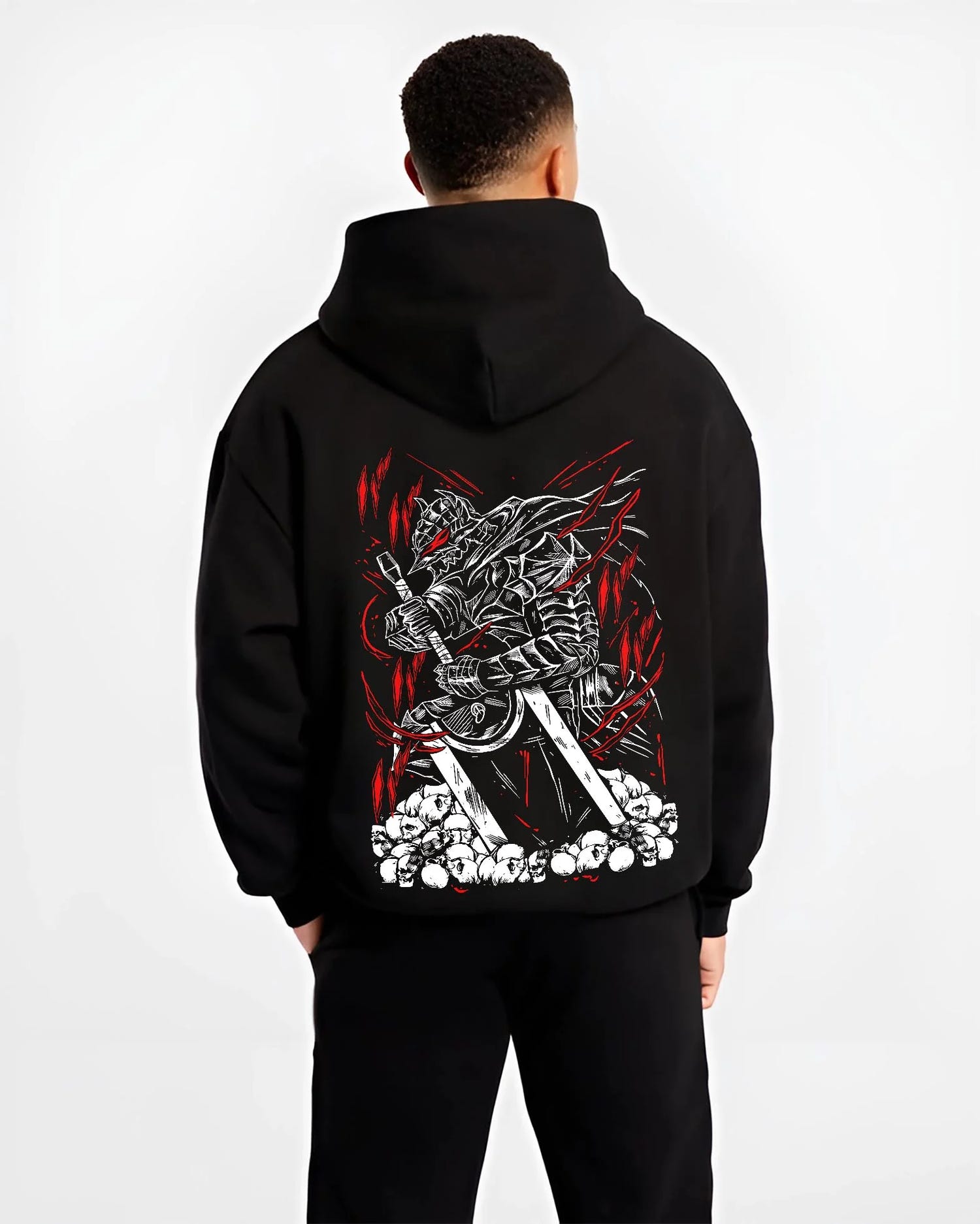 Black hoodie worn by male model, back view with Berserk Armour Hoodie Guts Berserker Armour Strike graphic Guts themed artwork.