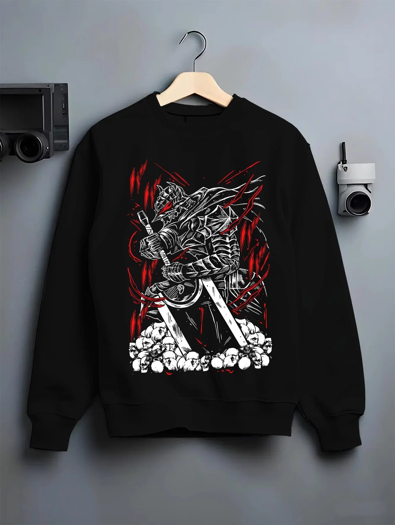 Black crewneck sweatshirt on hanger with Berserk Armour Hoodie Guts Berserker Armour Strike graphic Guts themed artwork.