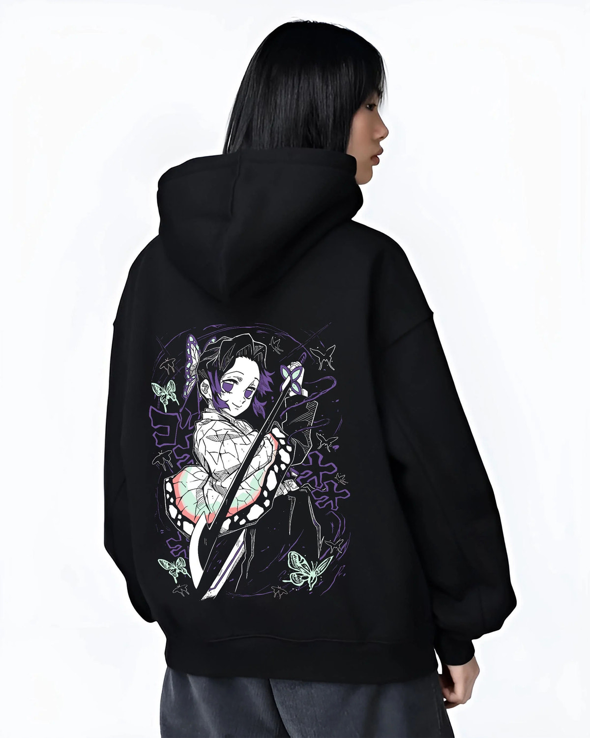 Black hoodie worn by female model from the back featuring Shinobu Kocho Butterfly Dance Demon Slayer artwork.