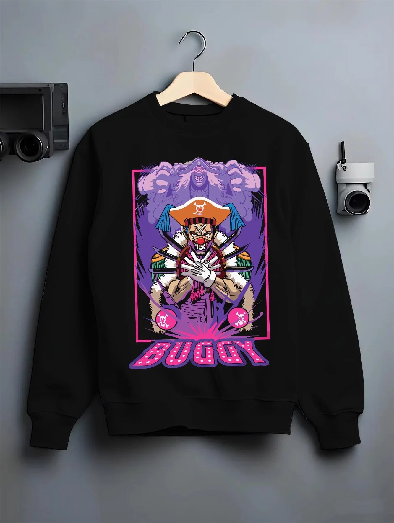 Black crewneck sweatshirt on hanger with Buggy Hoodie One Piece Pirate Clown Crew Retro Poster graphic premium wear.