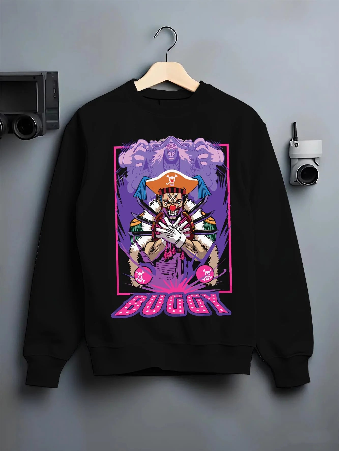Black crewneck sweatshirt on hanger with Buggy Hoodie One Piece Pirate Clown Crew Retro Poster graphic premium wear.