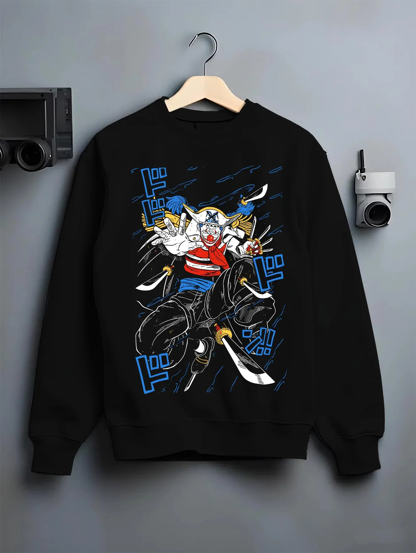 Black crewneck sweatshirt on hanger with Buggy the Clown Hoodie One Piece Pirate Retro Jump graphic bold anime graphic.