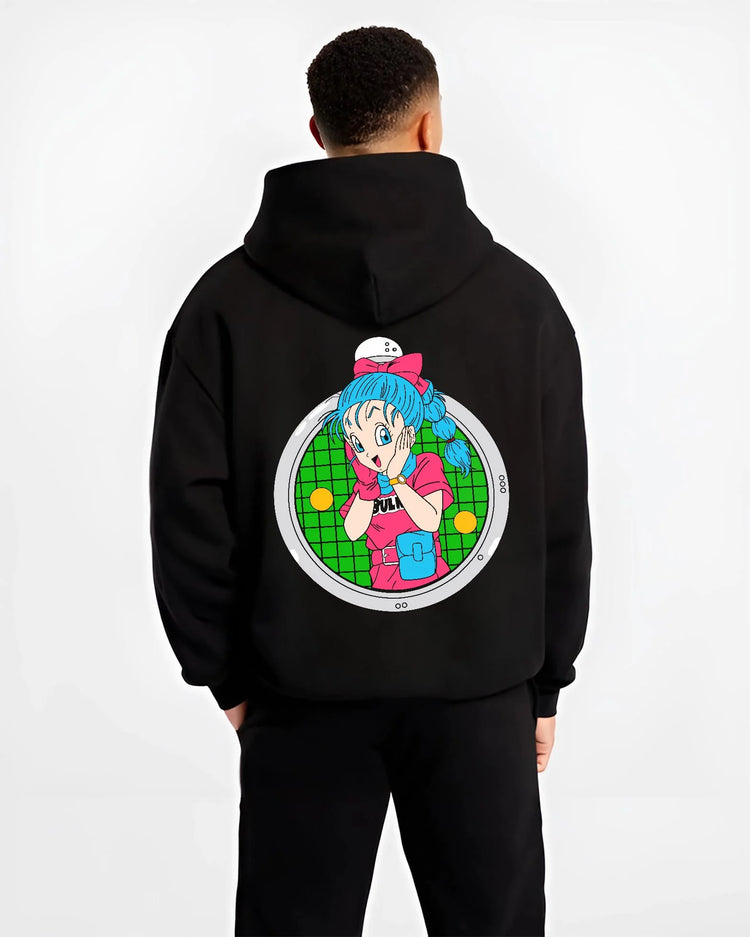 Black hoodie worn by male model, back view with Bulma Capsule Corp Hoodie Dragon Ball Z Retro Anime graphic premium wear.