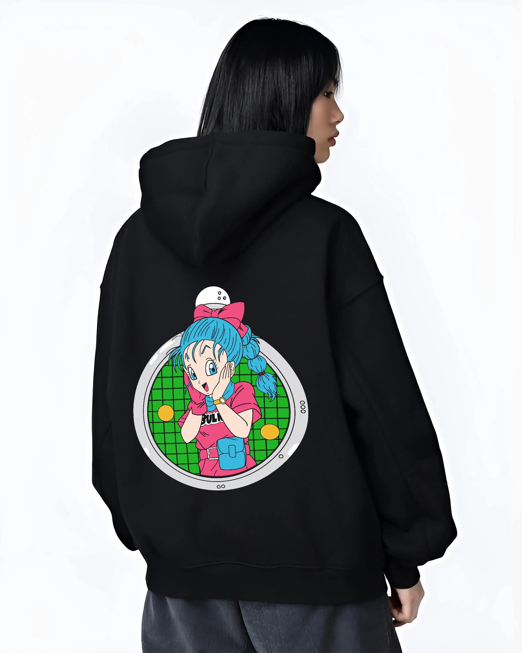 Black hoodie worn by female model, back view with Bulma Capsule Corp Hoodie Dragon Ball Z Retro Anime graphic premium wear.