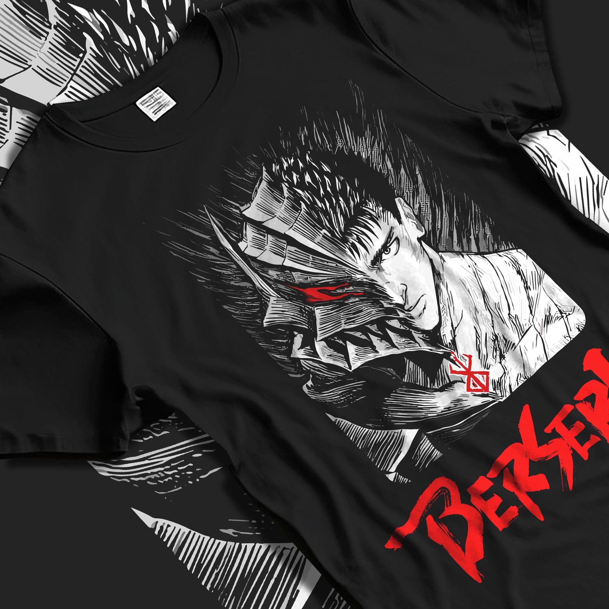 Black T-shirt laid flat with natural fabric folds, featuring Berserk Guts anime poster inspired split portrait graphic with bold red lettering in distressed manga style.