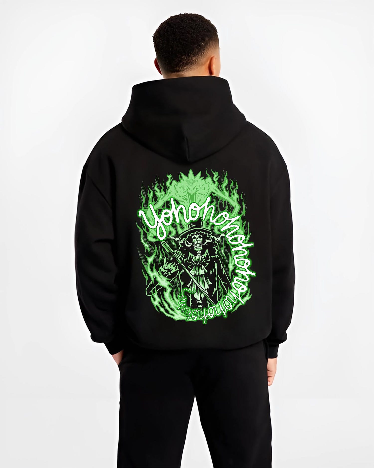 Black hoodie worn by a male model, back view, featuring One Piece Brook dark manga panel inspired artwork with neon green ghostly flame streetwear graphic design.