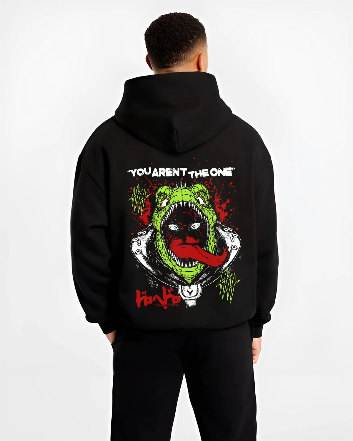 Black hoodie model back view showing Caiman from Dorohedoro: giant lizard-mouth grotesque poster