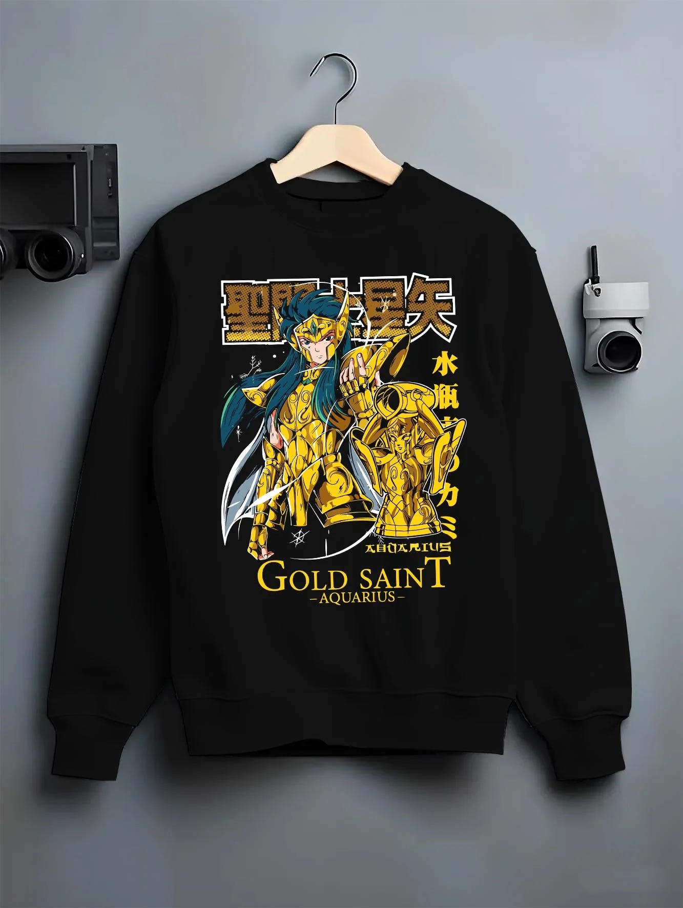 Black crewneck sweatshirt on hanger with Aquarius Gold Saint Hoodie Saint Seiya Zodiac Armour graphic streetwear graphic.