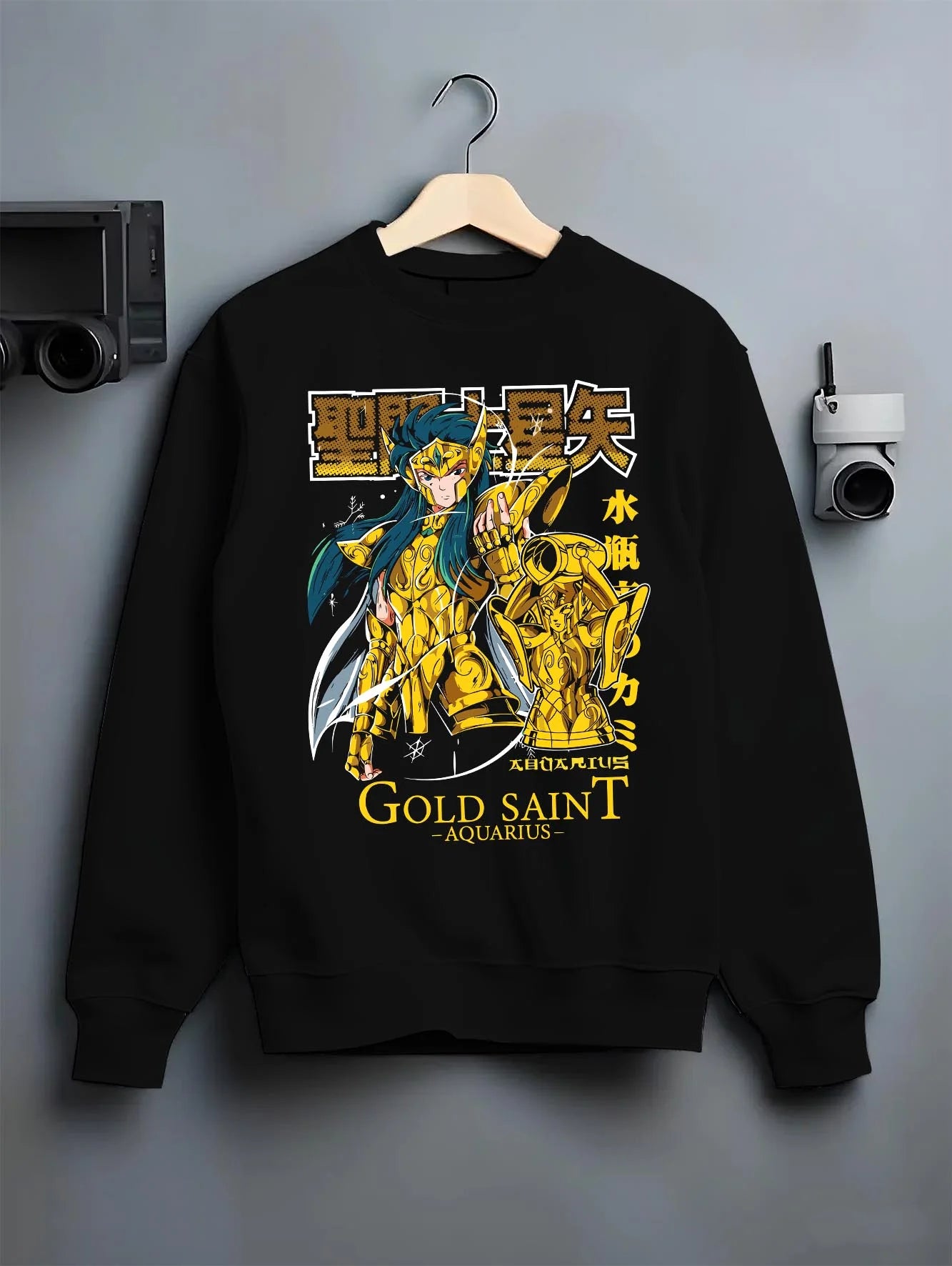 Black crewneck sweatshirt on hanger with Aquarius Gold Saint Hoodie Saint Seiya Zodiac Armour graphic streetwear graphic.