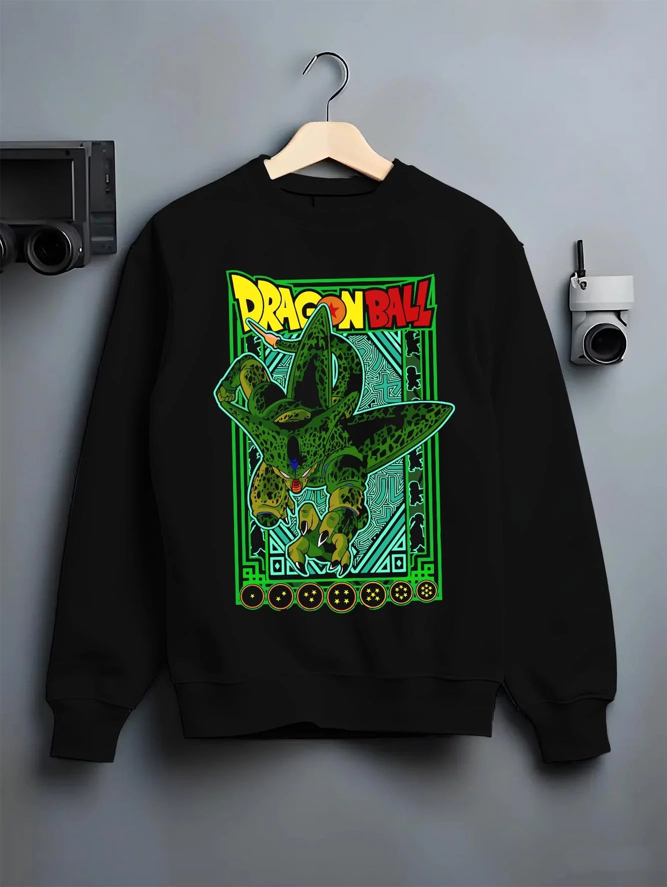 Black crewneck sweatshirt on hanger with Perfect Cell Hoodie Dragon Ball Z Villain Power Form graphic premium wear.