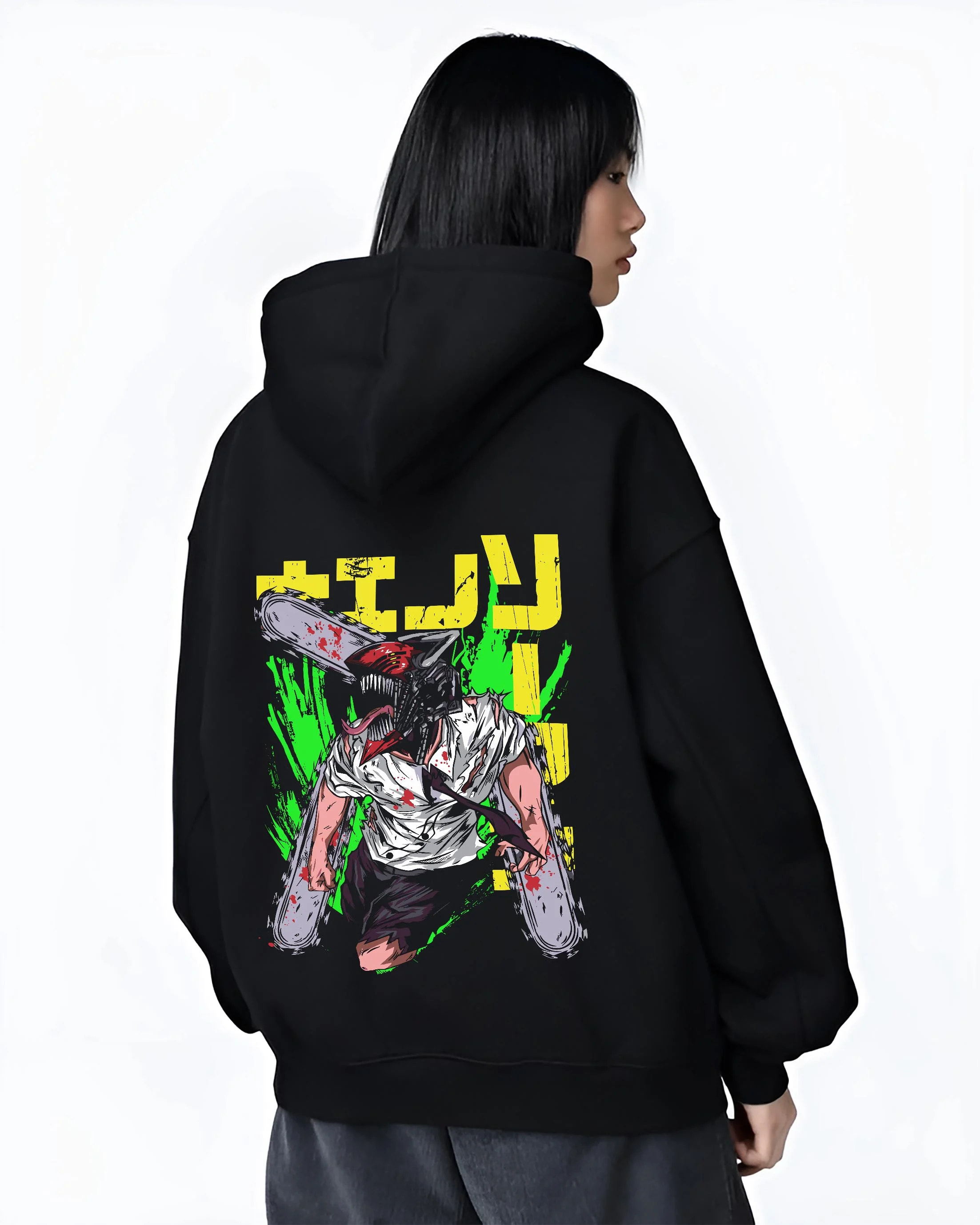 Black hoodie worn by female model, back view with Chainsaw Man Hoodie Denji Devil Hunter Green Slash graphic premium wear.
