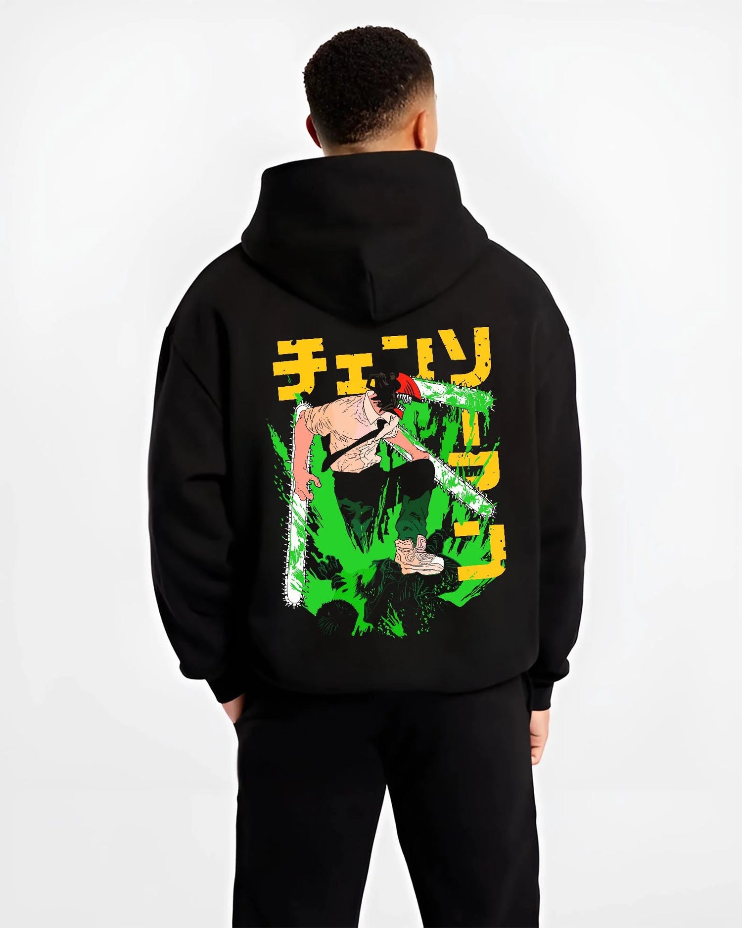 Black hoodie worn by male model, back view with Denji Chainsaw Man Hoodie Devil Hunter Fierce Strike graphic bold anime graphic.