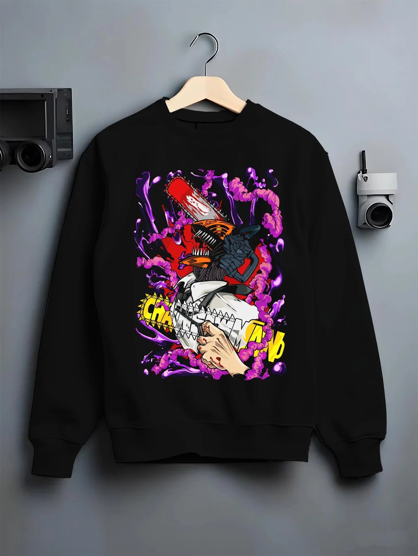 Black crewneck sweatshirt on hanger with Chainsaw Man Hoodie Denji Devil Hunter Red Chains graphic premium wear.