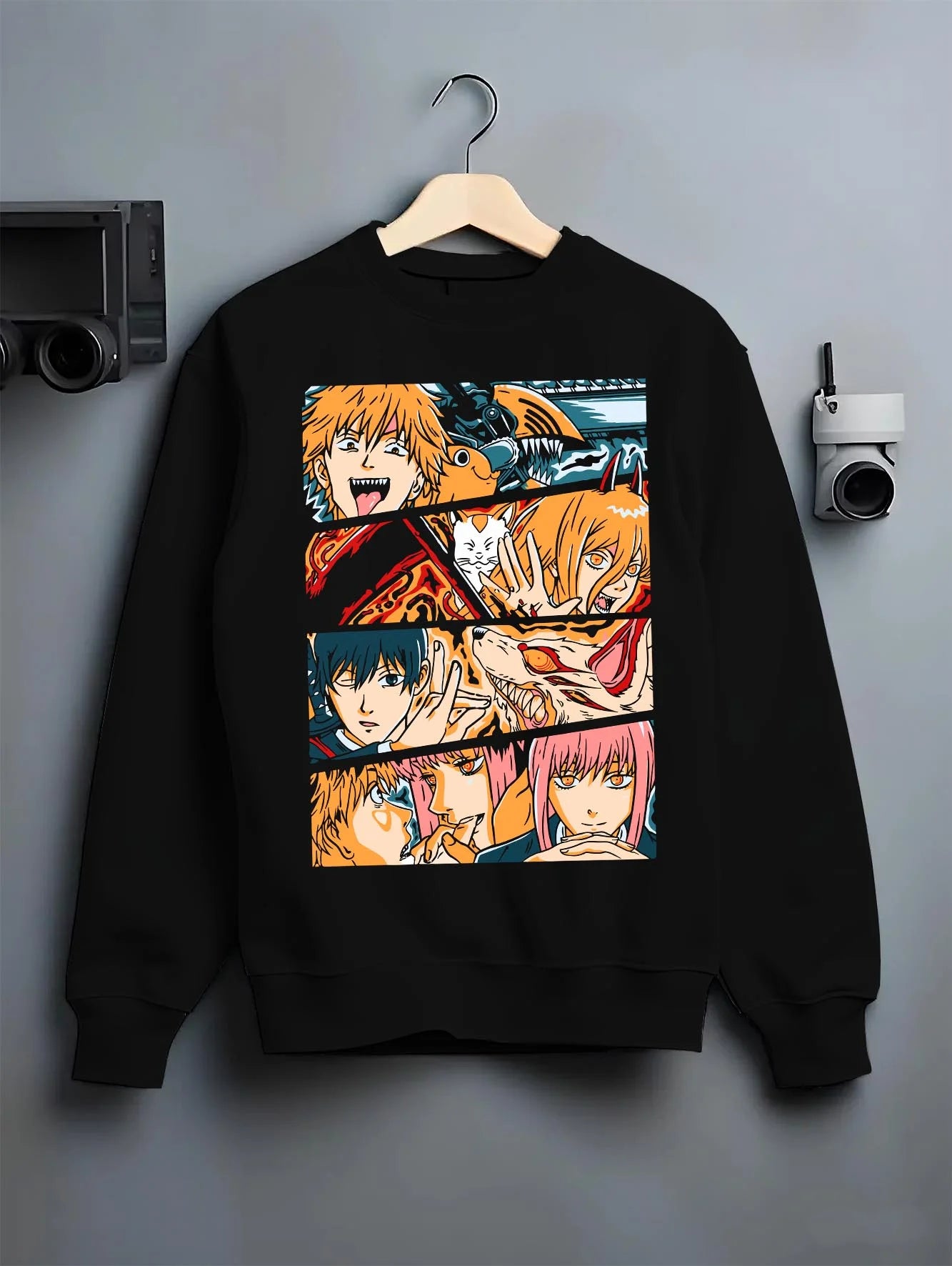 Black crewneck sweatshirt on hanger with Chainsaw Man Hoodie Power and Denji Squad Scene graphic streetwear graphic.